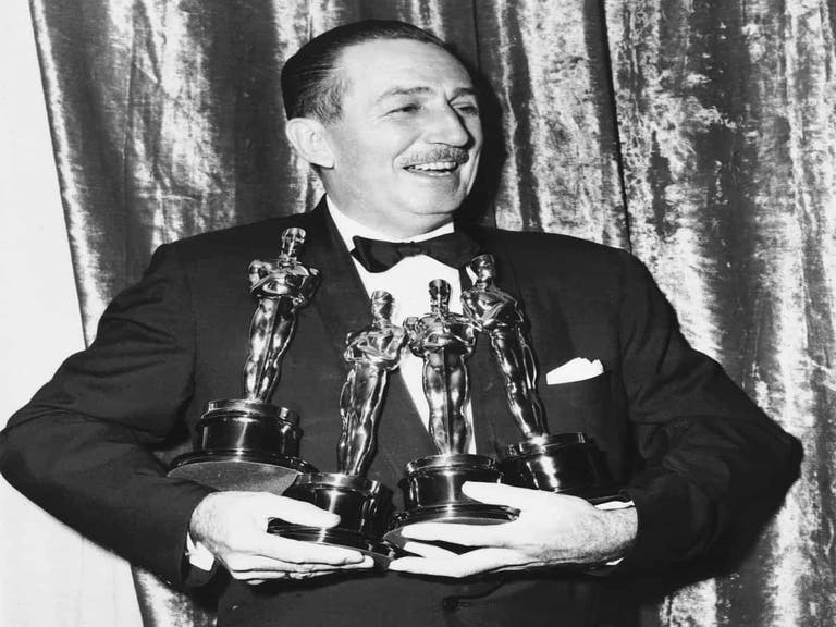 Walt Disney with his four Oscars at the 26th Academy Awards